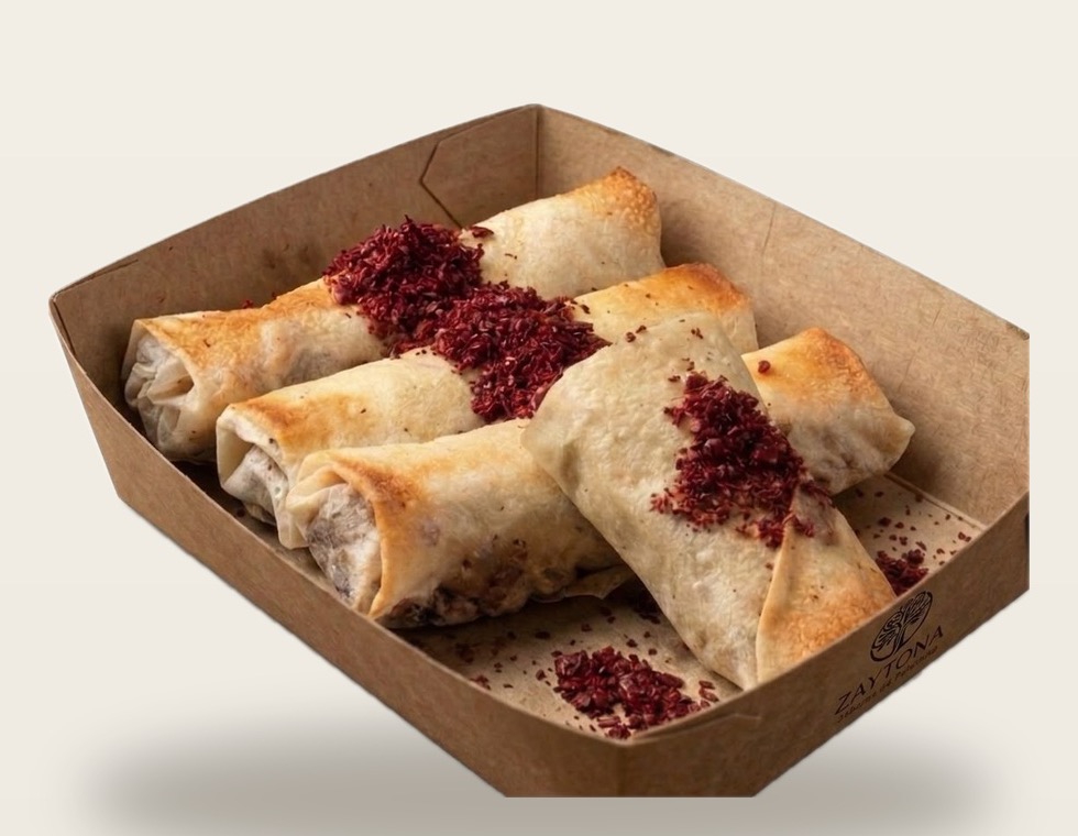 Rollitos de musakhan con cebolla caramelizada y sumac